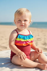 baby wearing a Carter's rainbow ruffle swimsuit